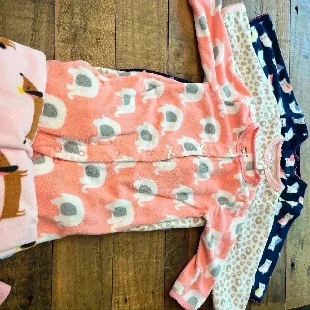 Six Carter’s Fleece Footie Pajamas